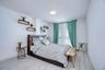 Bedroom featuring wood finished floors and baseboards