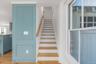 Stairway featuring wood finished floors