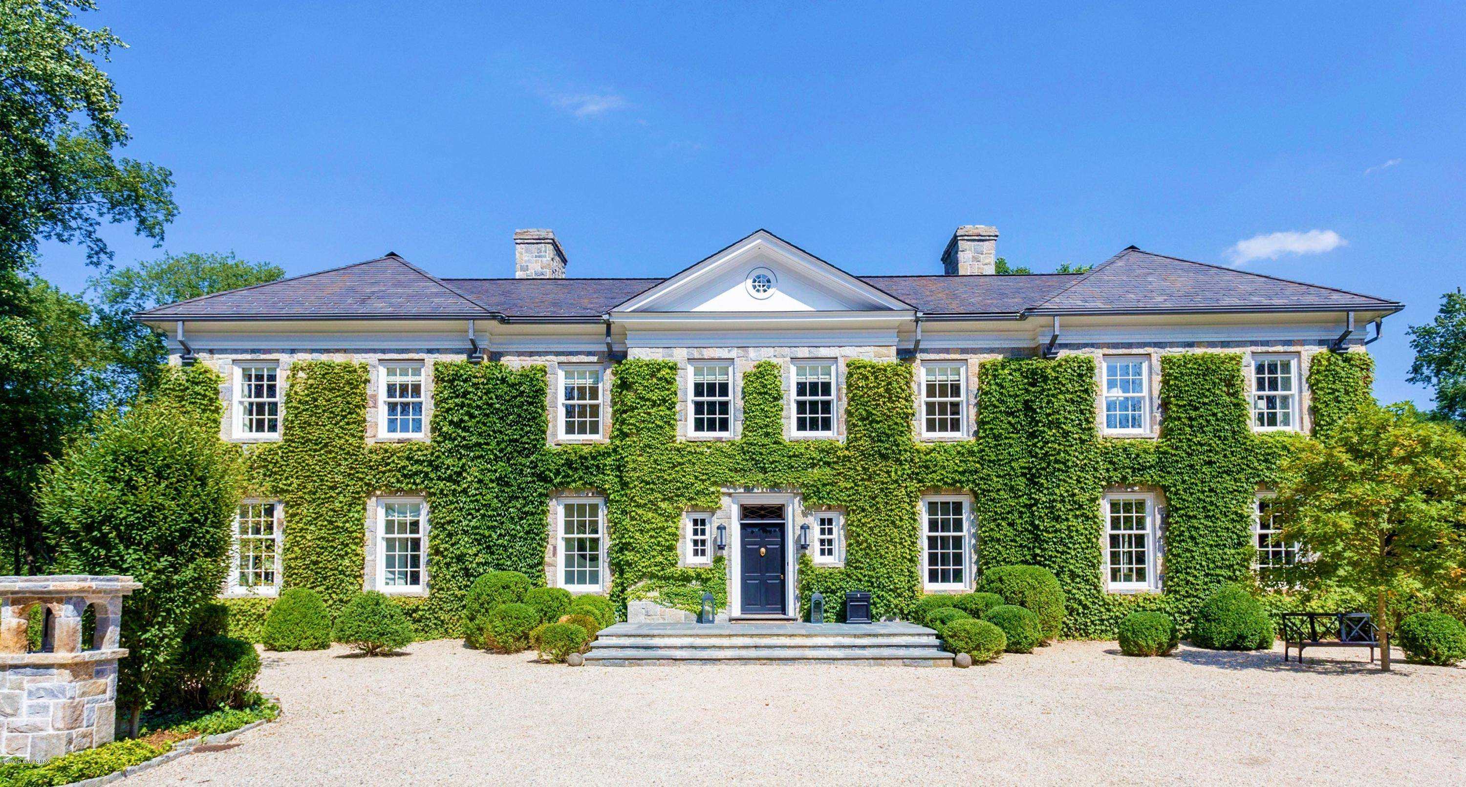 This elegant and stately Georgian manor nestled in a breath taking and private botanical garden of fruit trees, perennial gardens, trickling stream and pathways is constructed with hand chiseled stone ...