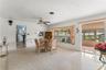 View of family room and informal eating area with view back into kitchen and sun room.