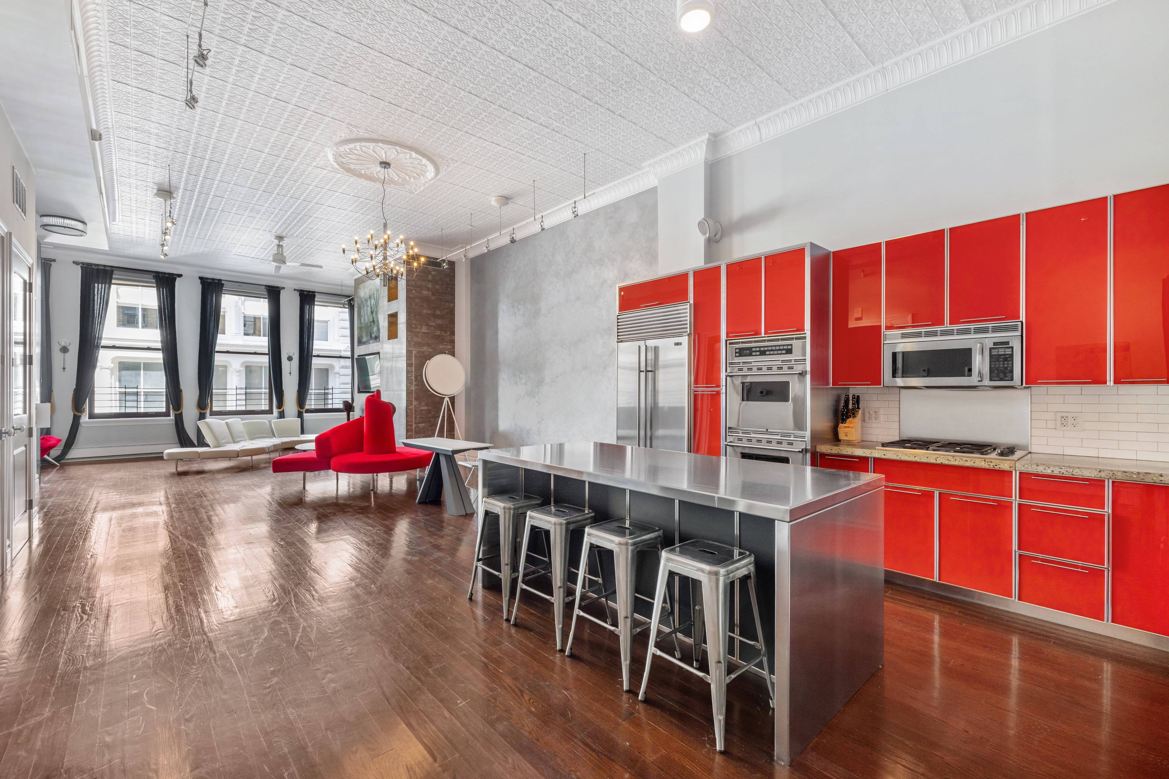 Introducing a Radiant SoHo Loft with Abundant Natural Light and 13 Foot Ceilings.