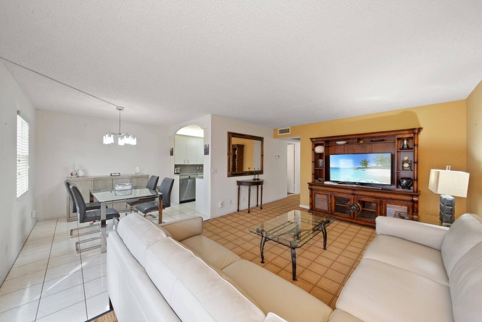 Step into your ideal sanctuary at Century Village, where contemporary luxury intertwines with everyday comfort in this stunningly renovated 2 bedroom, 1.
