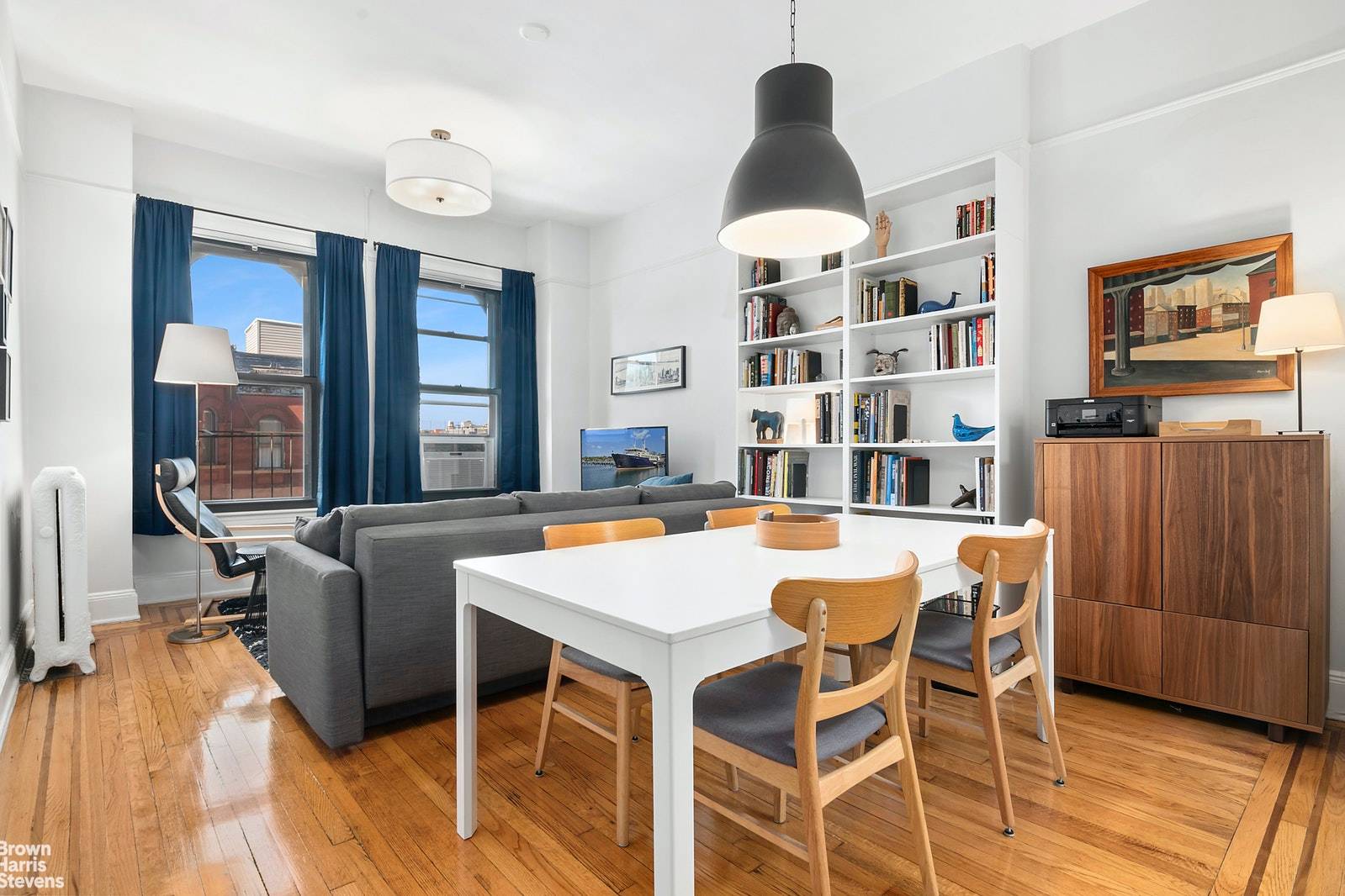 Located in a lovely pre war building, this Sun drenched convertible 1 bedroom apartment features hardwood floors throughout, high ceilings and X large windows.