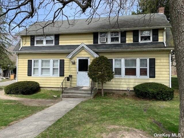 2 story free standing building with 2 office spaces on Montauk Highway with parking in rear.