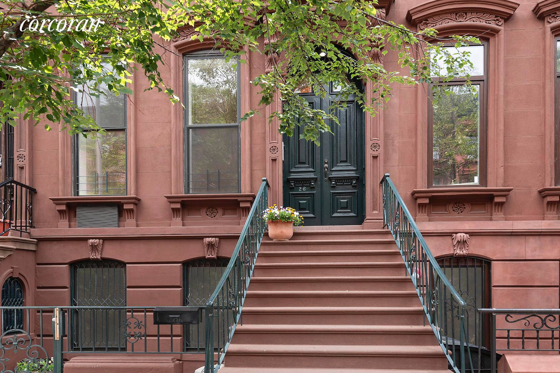 Like many of the historic townhouses near Fifth avenue, 26 E 126th has a grand sweeping stoop and classic facade.