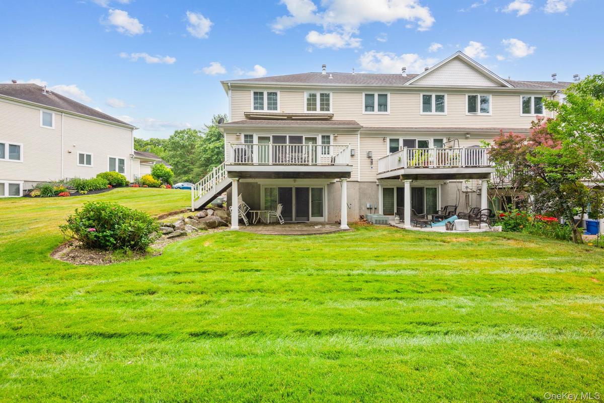 Back and East View with Staircase going from Deck to Lower Level Patio