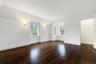 Second floor bedroom and dark wood-style floors, and built in features