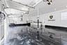Garage with a garage door opener and independent washer and dryer