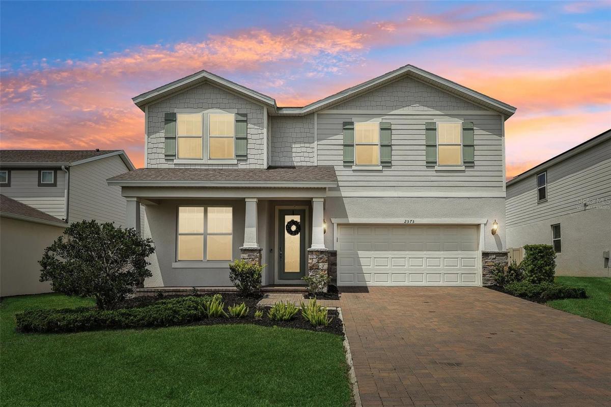 Virtually Staged grass & twilight -Front View
