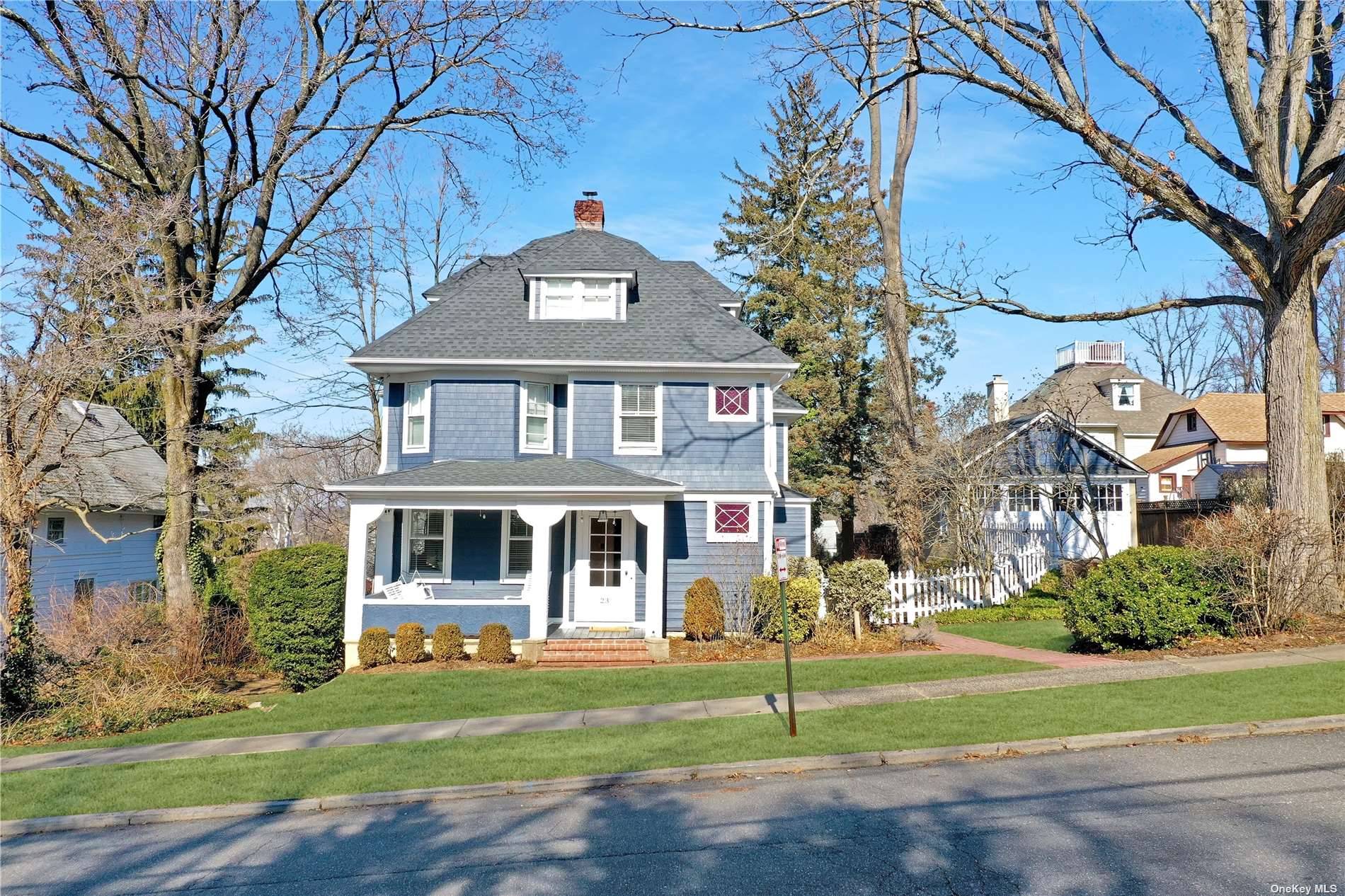 Beautifully restored and expanded 1906 front porch Colonial on a very rare 200 foot deep lot.