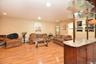Living room with light hardwood / wood-style floors and a baseboard heating unit