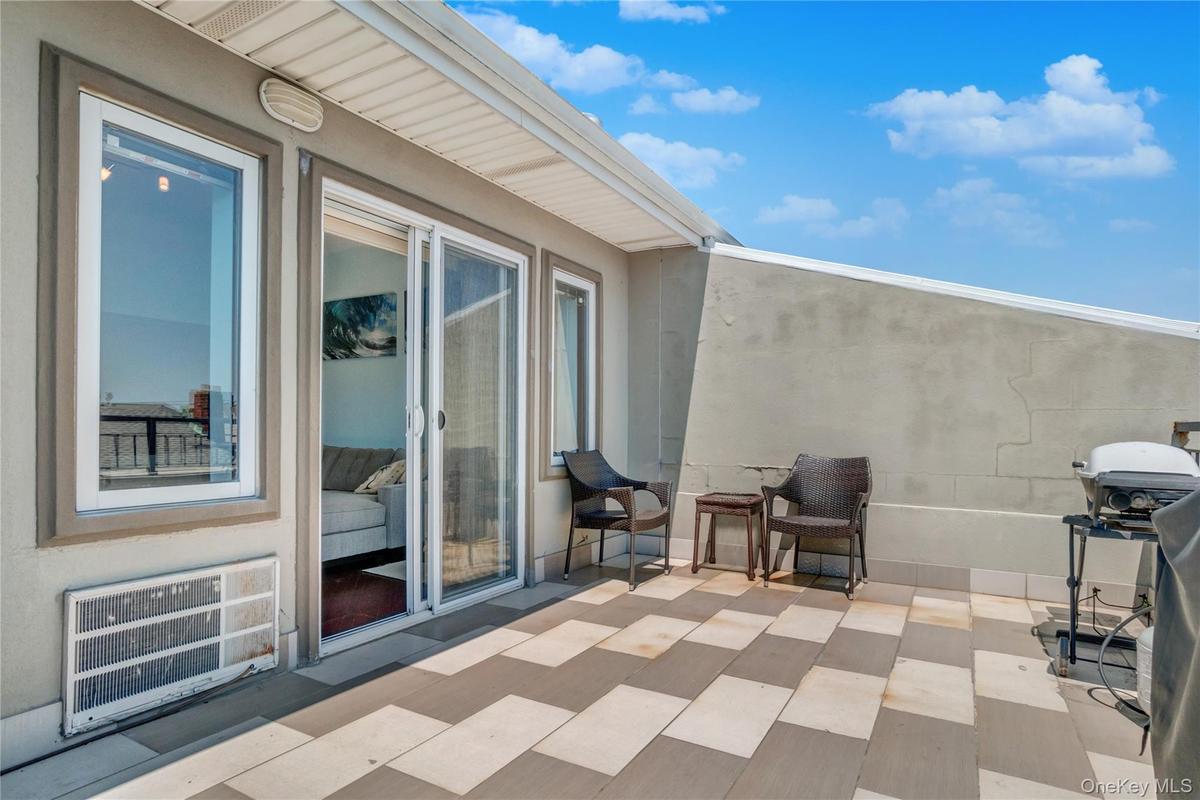 View of patio / terrace featuring area for grilling and heating unit