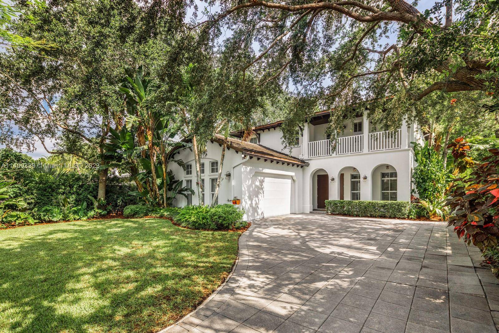 Stunning home on a quiet street in lush South Coconut Grove.
