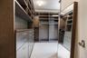 Walk in closet with carpet flooring