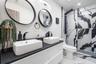 Bathroom #2 Located near the Family Room. Adjacent to Bedroom #2 and Bedroom #3. Double Sink Free Floating Vanity. Marble Flooring, Shower with Moder