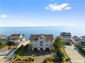 Nestled along the picturesque shores of Long Island Sound in Connecticut, this luxurious beachfront home sits on.