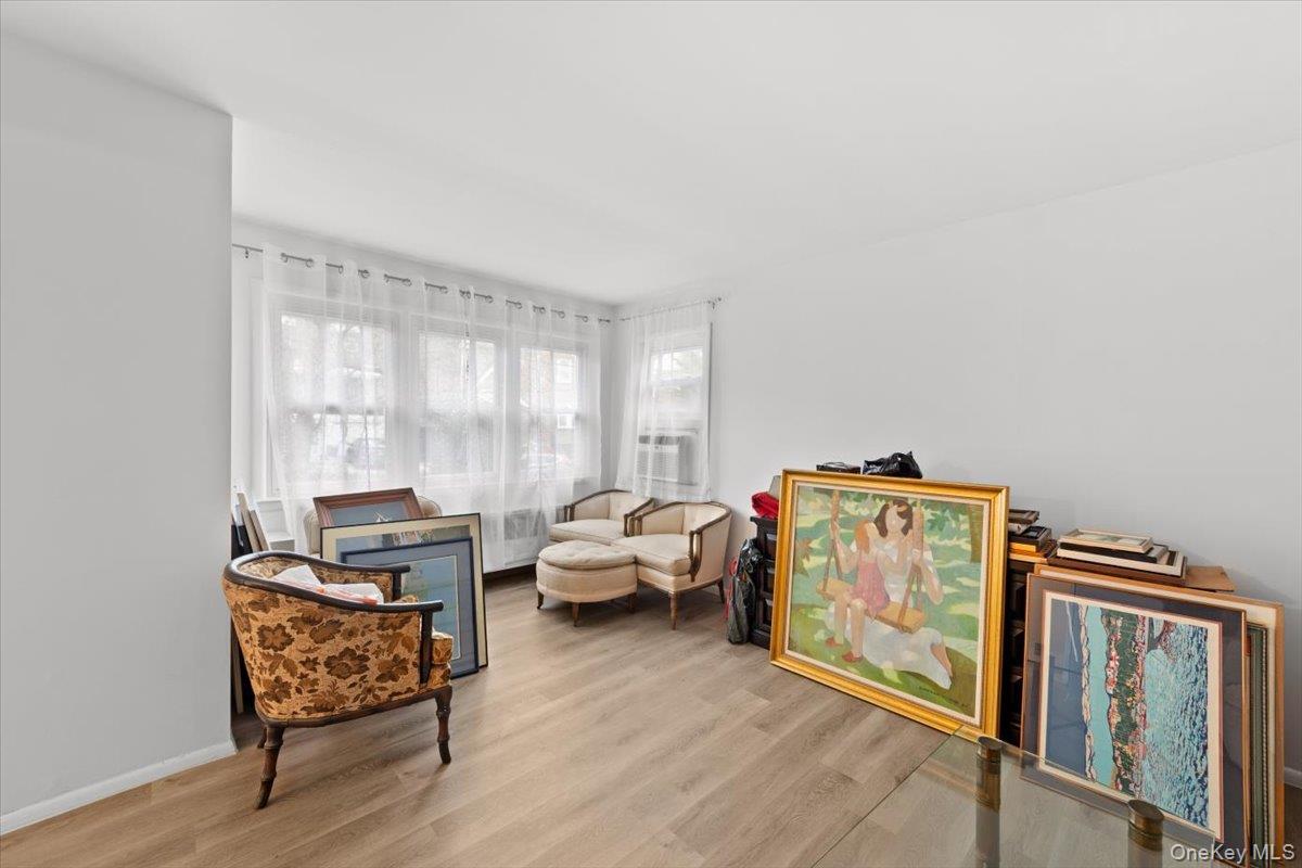 Bright open and airy living room with new luxury vinyl flooring and freshly painted.