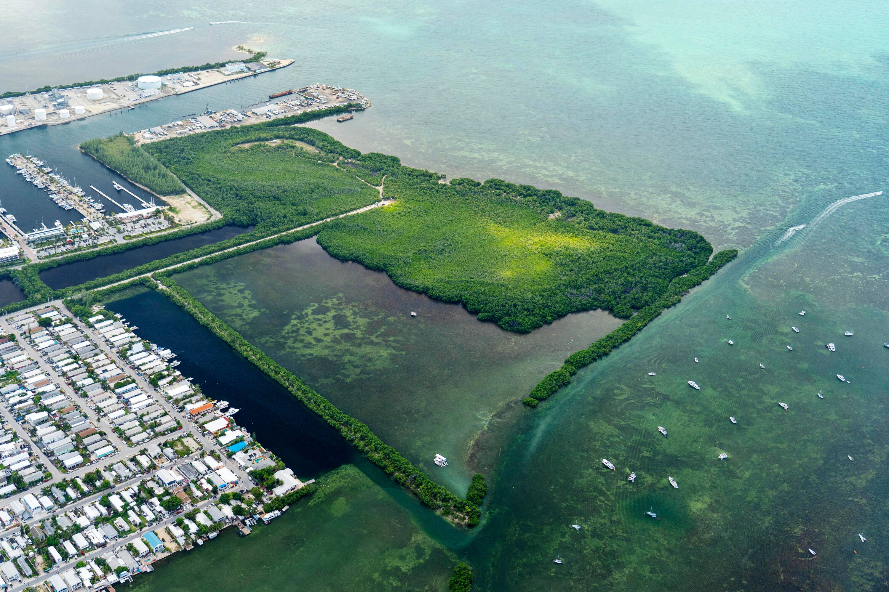 Nestled along the serene waterfront, these two picturesque parcels offer an unparalleled opportunity to indulge in the quintessential Florida Keys lifestyle.