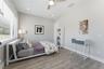 Generous 3rd Bedroom Upstairs with natural light and spacious balcony adding bonus outdoor living