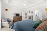 Primary Bedroom Featuring a Coffered Ceiling and Crown Molding
