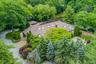 Follow the winding private drive through towering evergreens and discover a spectacular retreat completely secluded from the road.