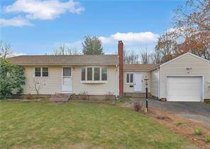 Experience suburban bliss in this lovely 4 bedroom, 2 bathroom ranch situated on a corner wooded lot in charming Enfield, CT.