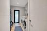 Full Size laundry room with storage and server/brain for home smart system