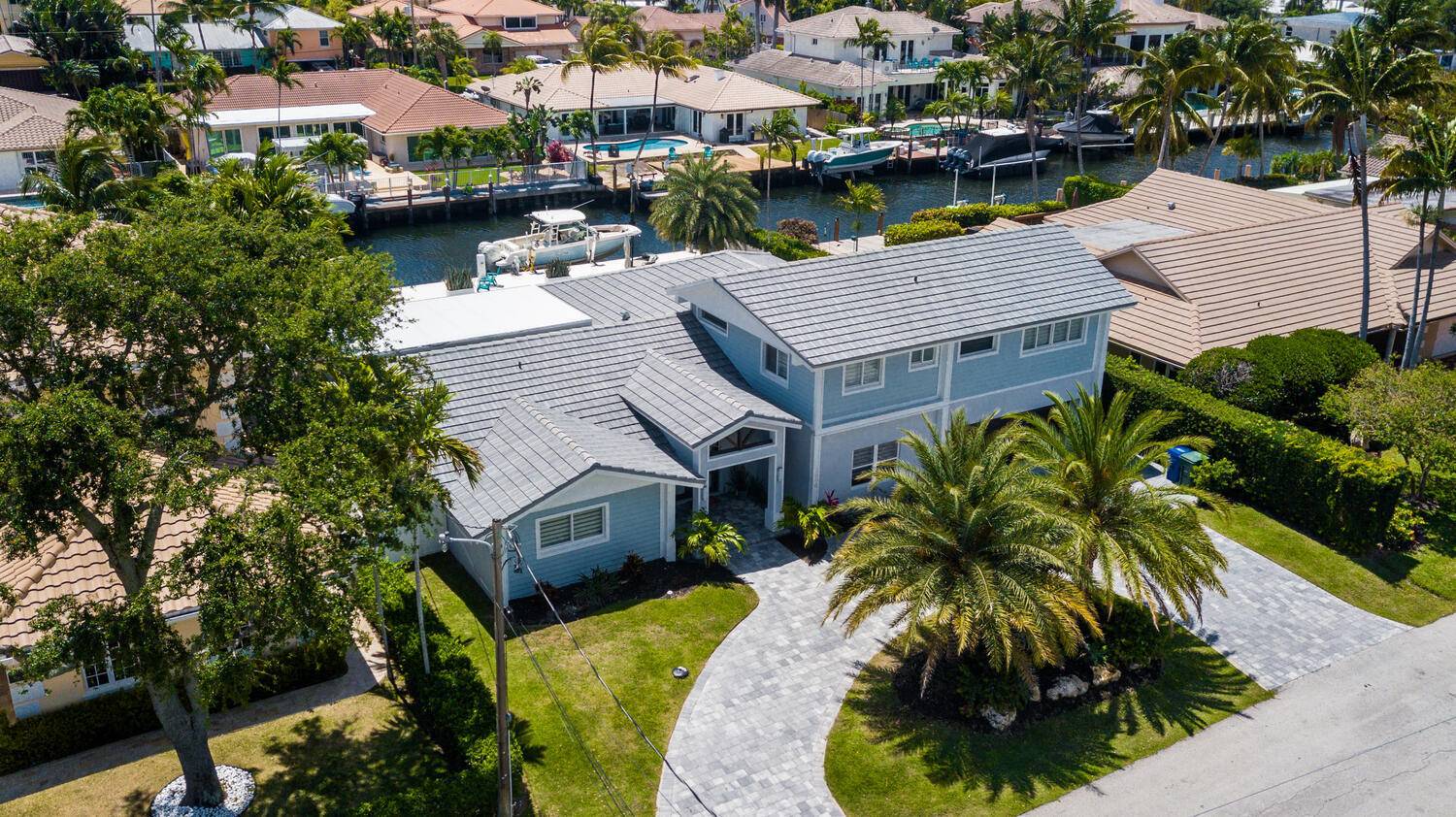 Completely Remodeled Waterfront Home Located In Coral Ridge Country Club.