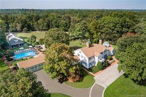 Poised on over fourteen majestic acres in the heart of Greenfield Hill, this spectacular family compound enjoys unmatched privacy, minutes from shopping and dining.