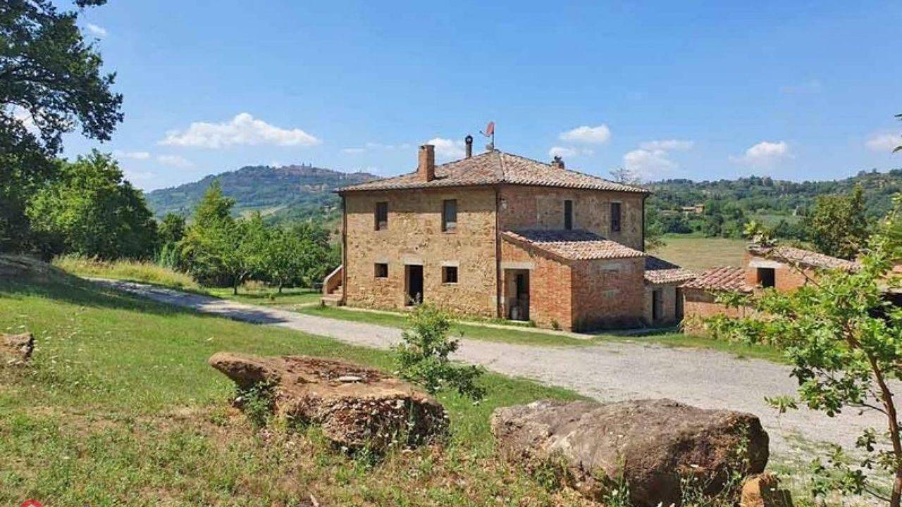 Partially renovated typical Tuscan farmhouse with panoramic views and land for sale in Montepulciano, Siena.