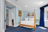Carpeted bedroom featuring ornamental molding and recessed lighting