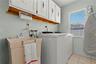 Inside laundry area with a sink.
