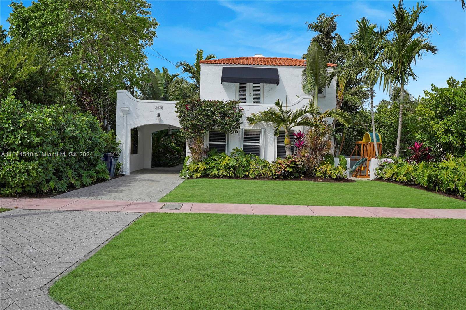 Nestled in Miami Beach's coveted neighborhood, this renovated 1930s two story home blends timeless charm with modern elegance.