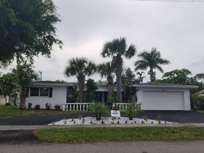 Gorgeous renovated furnished 3 bedroom has new flooring and screened in patio in an exclusive neighborhood in east Boca Raton.