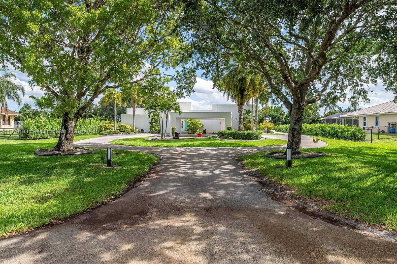 Incredible 5 bedroom 2. 5 bathroom Modern Masterpiece situated on a Builder s ACRE of land in one of the most desirable areas of Davie !