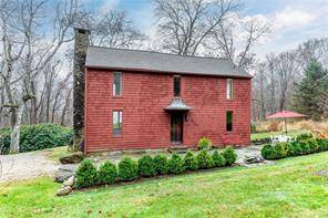 Charming and bright guest cottage with beautiful distant views of Lake Waramaug in a park like setting with a lovely stone patio, and separate driveway and parking.