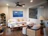 Living area featuring recessed lighting, ceiling fan, and wood finished floors