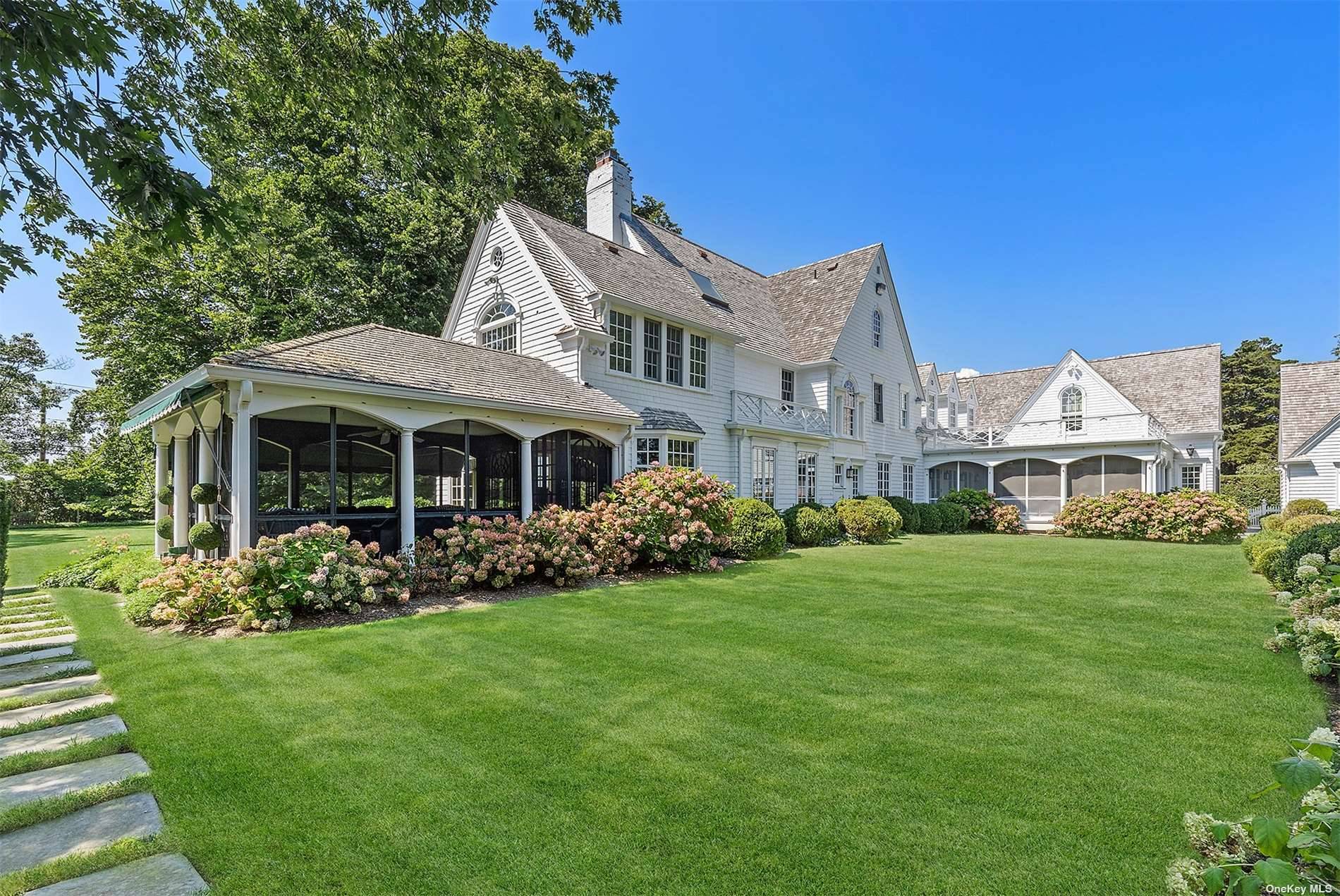 Tucked behind manicured hedges, this 9 bedrm hidden oasis known as Twelve Oaks is located in the heart of Westhampton Beach Village.