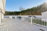 View of backyard deck off back sliding doors.
