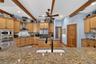 Gourmet Kitchen with Stainless Steel Appliances and Walk-In Pantry