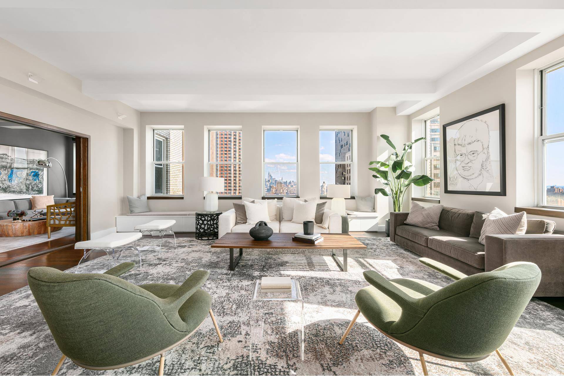 Drenched in natural light throughout the day through its 35 windows facing south, north, and east, this splendid TriBeCa loft showcases a collection of New York City's most iconic landmarks.