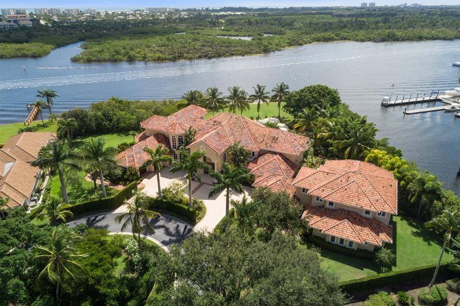 Direct intracoastal, oversized point lot situated on nearly 1.