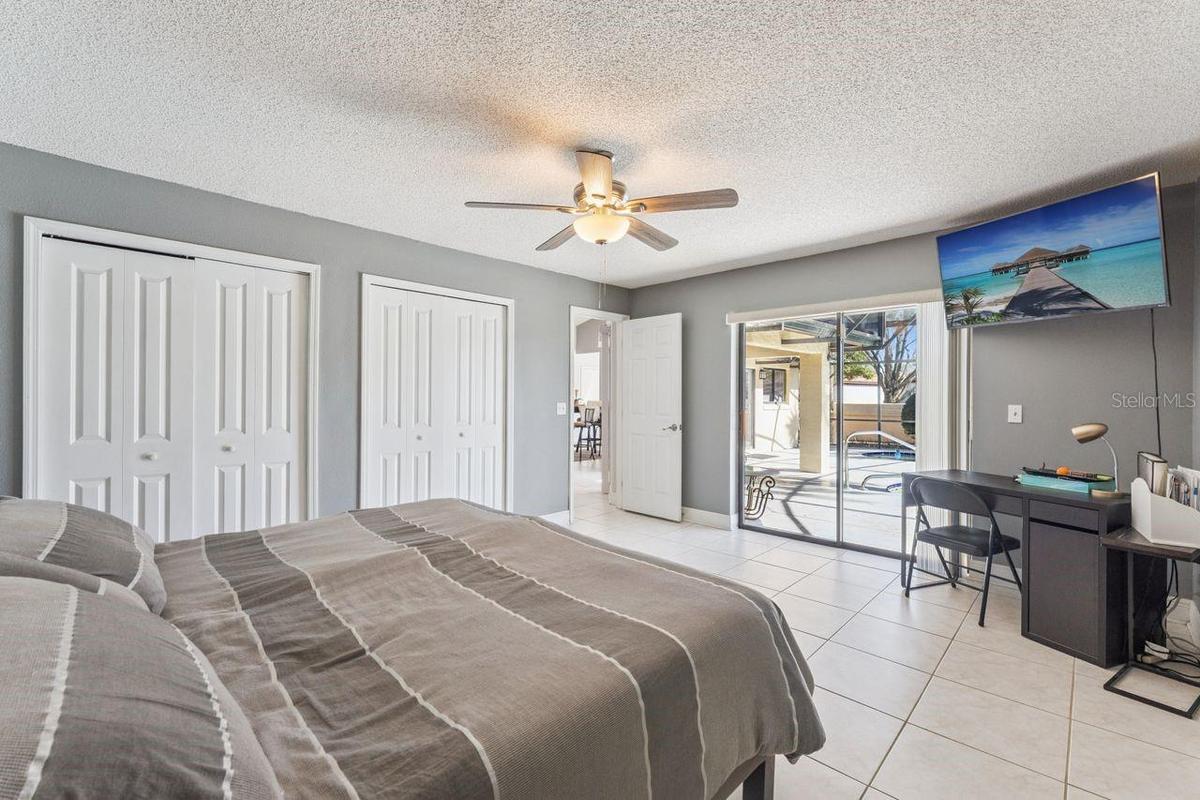 Third bedroom with view of pool