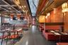Community lobby featuring wood walls and beam ceiling