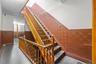 Stairway featuring a wainscoted wall