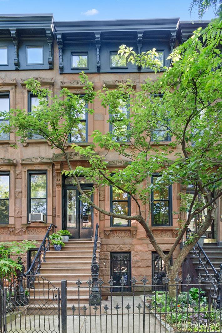 Renovated to the highest standard, this four story Italianate brownstone strikes a delightful balance between historic preservation and modern sensibilities.