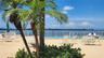 The expansive pool and surrounding pool deck offer plenty of seating and lounge chairs