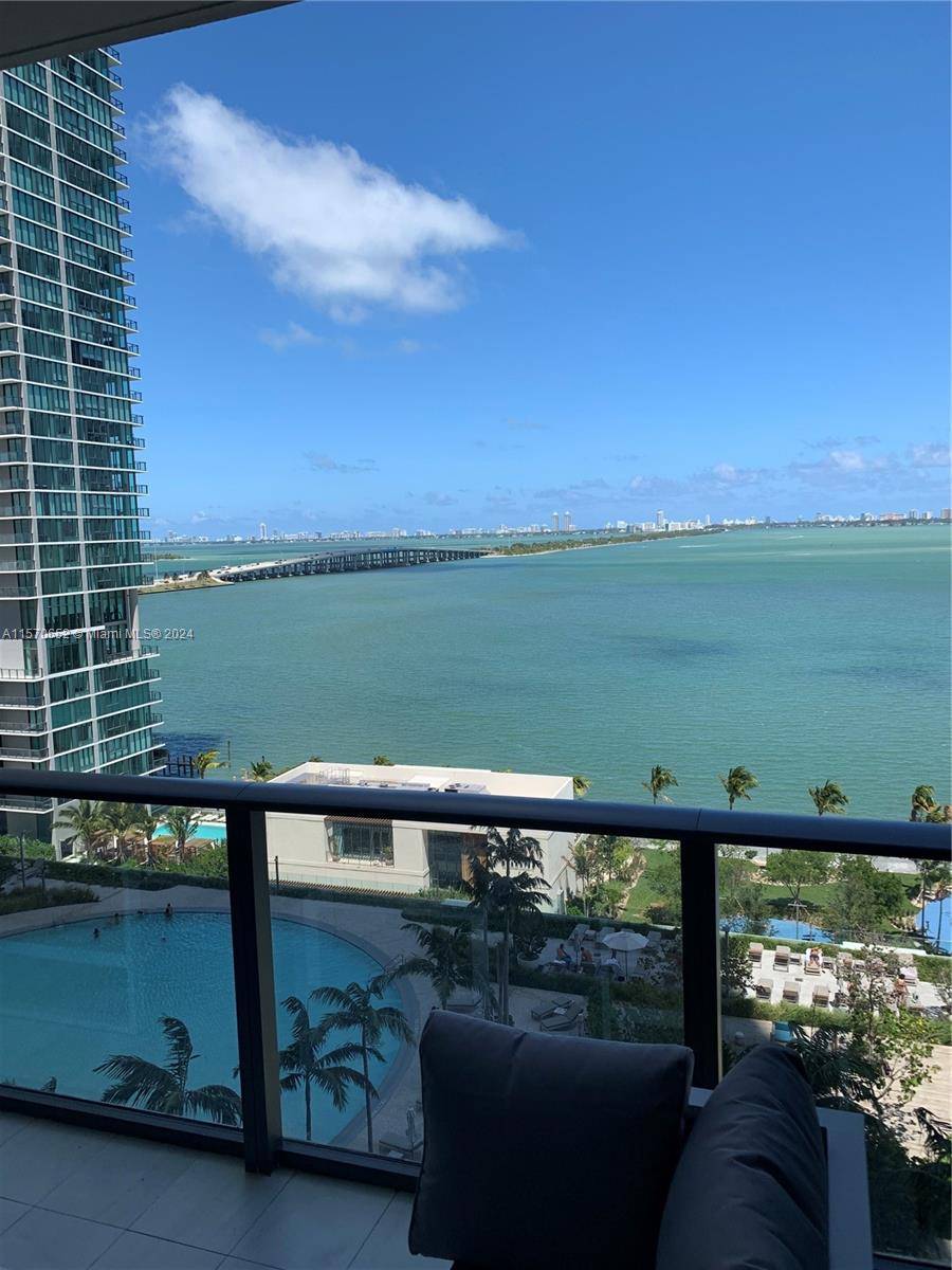 Gran Paraiso magnificent unit, 2 bed, 3 bath Professionally decorated and furnished with unobstructed breathtaking bay and ocean views, Huge terraces, floor to ceiling windows, 10 foot high ceilings, open ...