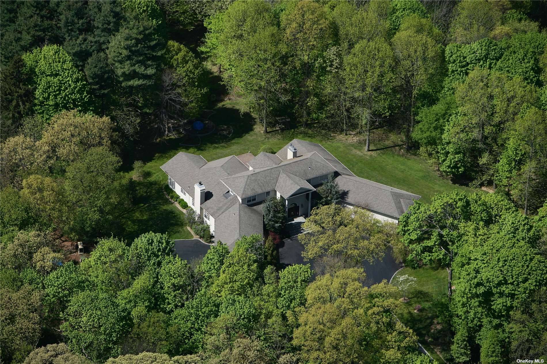 Situated On 5 Lush Acres Resides This Beautiful Home on Duck Pond Road.