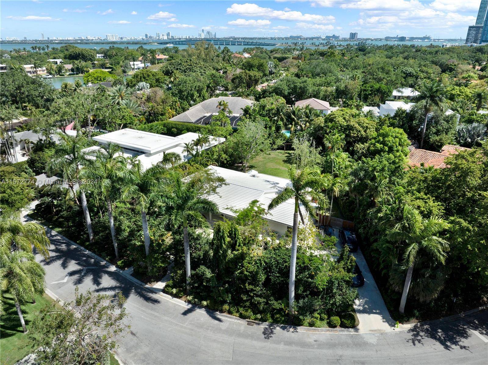 Nestled in a prestigious gated community near Design District, this lowest priced not by the wall residence, epitomizes luxury living in the heart of Miami's Art District.